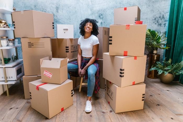 lady with packed boxes for moving